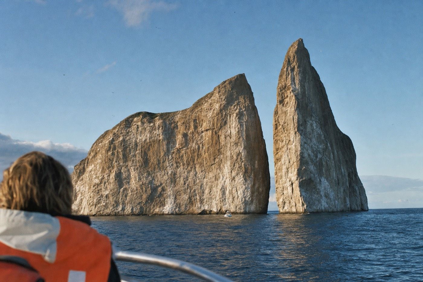 Kicker Rock, an eroded volcanic tuff cone split in two, rising from open ocean near San Cristobal
